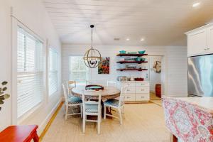 a kitchen with a table and chairs in a room at Perfectly Located Retreat with Grill, Fireplace, & Chef in Boothbay Harbor