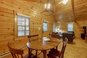 a dining room with a table in a cabin at Comfortable two bedroom cabin with firepit, kitchen, hiking trail within walking in Northport +32 photos