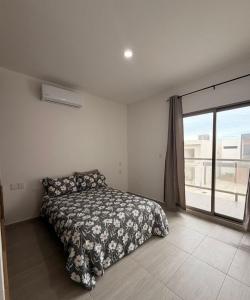 a bedroom with a bed and a large window at Private pool house near the beach in Heroica Alvarado +43 photos