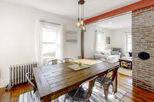 a dining room with a wooden table and chairs at Coastal home with new, full kitchen, walkable downtown location in Boothbay Harbor +23 photos