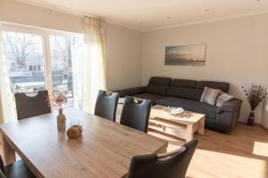 a living room with a table and a couch at Melanie in Lenz