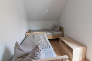 a small room with a bed in the corner at Melanie in Lenz