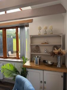 a kitchen with a counter and a window at Ben Wyvis View Annexe in Inverness