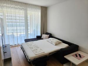 a small room with a bed and a window at Luxury Apartment "Ema", sea view in Split