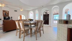 a kitchen and dining room with a table and chairs at Recently Renovated Oceanview Home Casa Hebe in Puerto Peñasco +17 photos