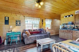 a living room with a couch and a table at Cozy Cabin with Ocean and Mountain Views, Free Internet in Sullivan +11 photos
