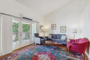 a living room with a couch and chairs and a table at Bay View Dog-Friendly Townhouse w/Porch, Gas Grill, Washer/Dryer, Partial A/C in Bar Harbor