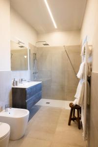 a bathroom with a sink and a toilet and a shower at Cascina Bella - Piozzo in Piozzo +68 photos