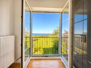a room with glass doors and a balcony with a view at Kiek ut in Stein