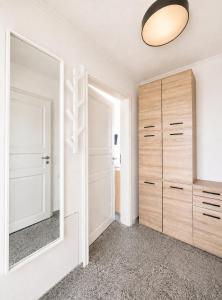 a bedroom with a mirror and a closet at Kiek ut in Stein
