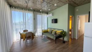 a living room with a couch and a table at The Best House in Ureki