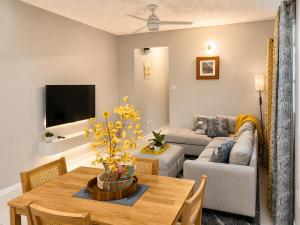 a living room with a table and a couch at Ocean Breeze Retreat in Basseterre