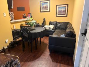 a living room with a couch and a table at Carson in Carson