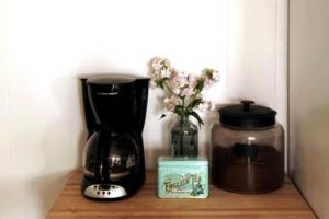 a coffee maker and a blender on a wooden shelf at Ocean-view cottage near beach with deck, grill, & full kitchen in Bristol +12 photos