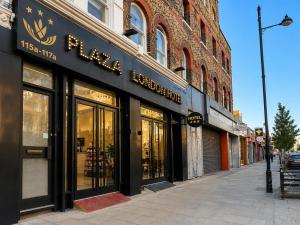 a store front of a building on a city street at Plaza London Hotel in London
