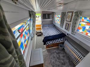 an overhead view of a bus with beds in it at Komet Canal Boats in Nantwich