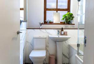 a bathroom with a toilet and a sink at Spacious One-Bed Apartment in Chester in Chester