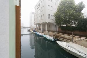a group of boats in the water next to a building at Ca' Dei Bolzeri in Venice