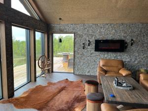 a living room with a couch and a table at Trudvang in Tänndalen
