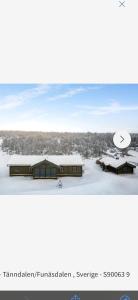 a picture of a building with snow on the ground at Trudvang in Tänndalen