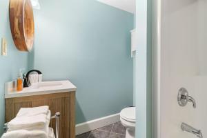 a bathroom with a sink and a toilet at Mabel's Maine Studio on the River in Edgecomb +14 photos