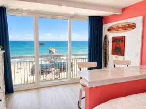 a bedroom with a view of the ocean at Updated Oceanfront Suite by Skywheel Yachtsman 902 in Myrtle Beach +50 photos