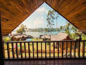 a view of a lake from a balcony at Home Stay TB2 in Palayangan