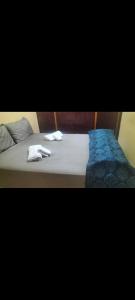 a bed with two towels on top of it at Maison Bab boujloud in Fez