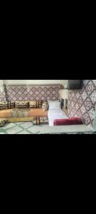 a bed with several pencils on top of it at Maison Bab boujloud in Fez