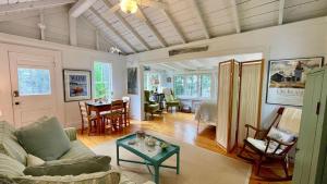a living room with a couch and a table at Whispering Spruces; Cozy Studio with Queen Bed & W in South Thomaston