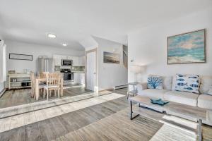 a living room with a couch and a table at Ocean Breeze West Wind – Updated 2BR/2BA home step in Owls Head
