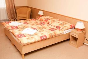 Uma cama ou camas num quarto em Hotel Clavis