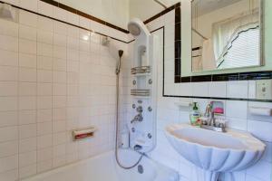 a bathroom with a sink and a shower with a mirror at Welcome to your private cozy room #2 near LU, Stadium & general hospital in Lynchburg