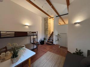 a living room with a loft with a staircase at Agriturismo Feudo Tudia in Resuttano +60 photos