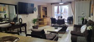 a living room with a couch and a table at Suites Atlas - Ocean Front in Bucerías
