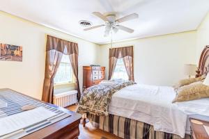 a bedroom with two beds and a ceiling fan at Welcome to your private cozy room #2 near LU, Stadium & general hospital in Lynchburg