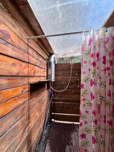 a room with a shower with a shower curtain at Каравана Кукер in Sozopol +6 photos