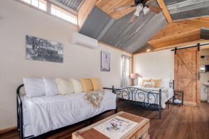 a living room with a couch and a table at Hill Country Cabin 3 in Canyon Lake