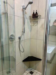 two people standing in a shower in a bathroom at Bamboo in George