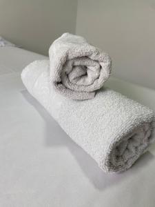a white towel sitting on top of a counter at Pousada São José in Joinville +88 photos
