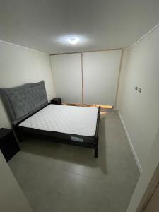 a small room with a bed in it at Comodidad, descanso y disfrute in Algarrobo +23 photos