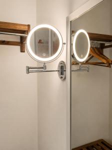a mirror on the door of a bathroom at Orizzonti in Ortona