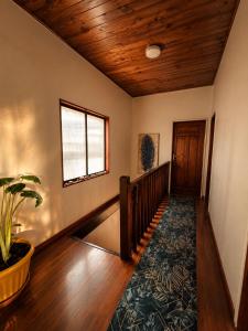 a hallway of a house with a wooden ceiling at Casa Vista Pacífico in Concón