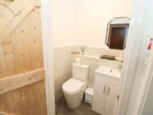 a bathroom with a toilet and a sink at Teach Feirme in Clonakilty +39 photos