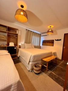 a hotel room with two beds and two lamps at Nazareth Cânion in Buriti dos Montes +40 photos