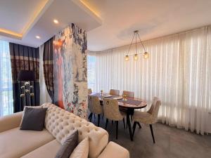a living room with a couch and a table at SA Apartments! 2BR Flat 100m to Cleopatra Beach in Alanya