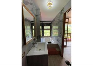 a large bathroom with a tub and a sink at MONTEVERDIA - Hotel & Resort in Pozuzo +32 photos