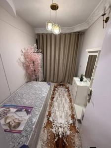 a bedroom with a bed and a staircase in it at Abu sobh holiday in Alexandria