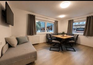 a living room with a couch and a table at Haus Antonia in Zams
