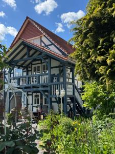 a home with a blue and white house at PARADISE GARDEN in Bad Sooden-Allendorf